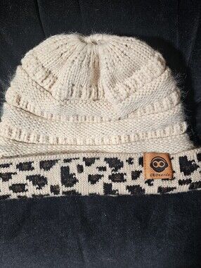 Leonardo Knit Beanie Hat With Ponytail Cutout Off White Leopard Print